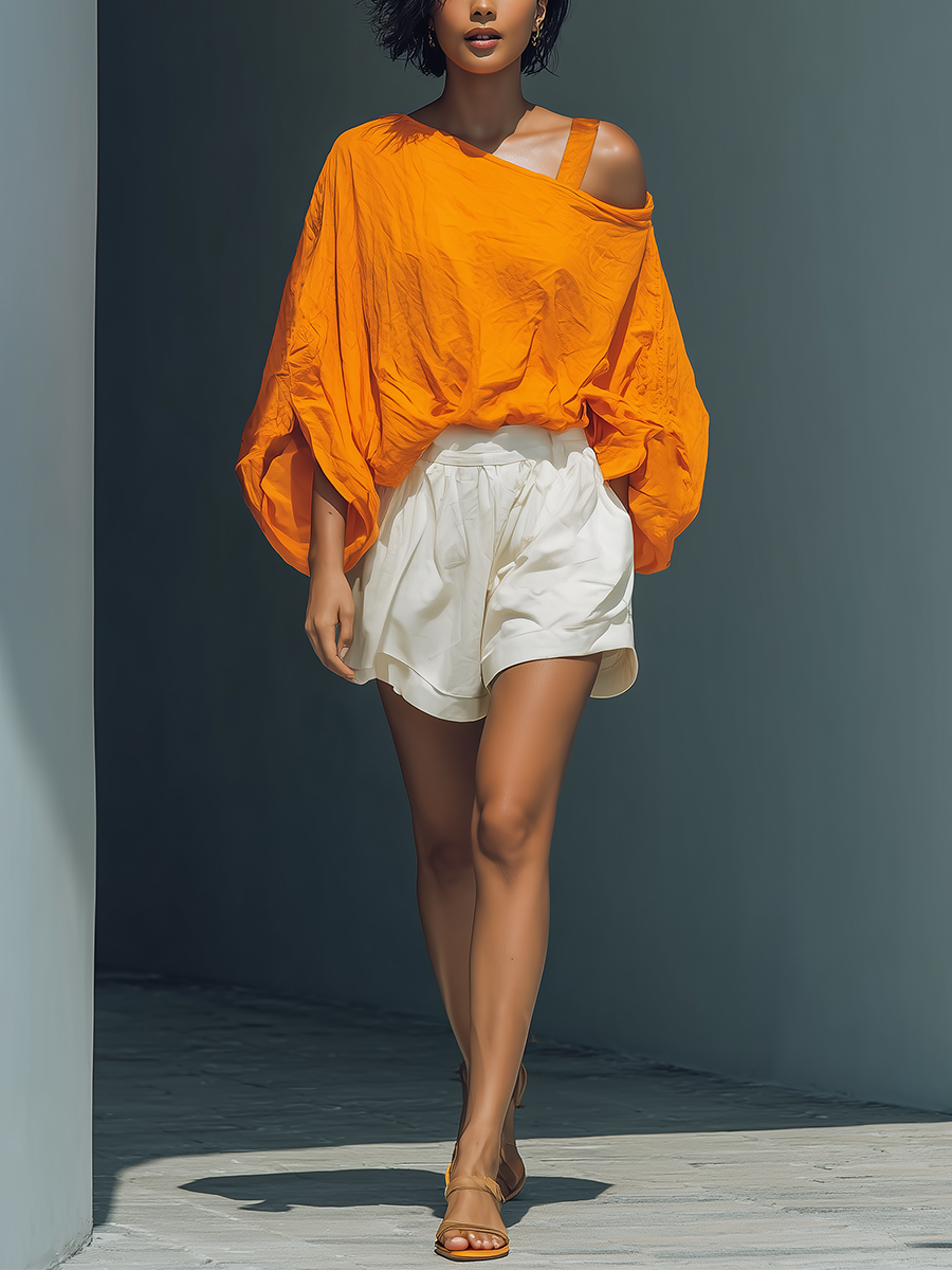 Orangefarbenes trägerloses Leinenoberteil und weiße Shorts mit Rüschen