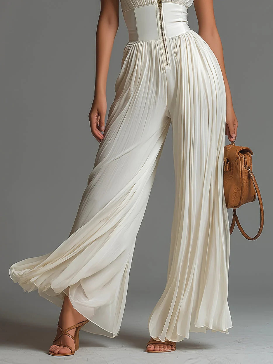 ÉLAN – Skulpturaler Plissee-Jumpsuit